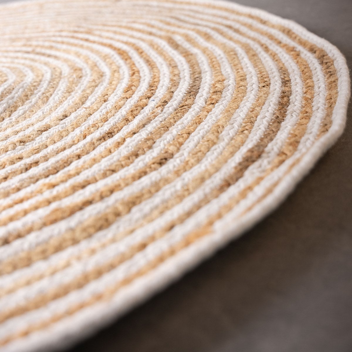 Alfombra redonda trenzada de yute blanca y natural de Ø 100 cm