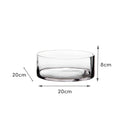 Jarrón cilíndrico transparente.