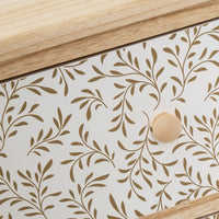 Mesita de noche con cajones tapizados